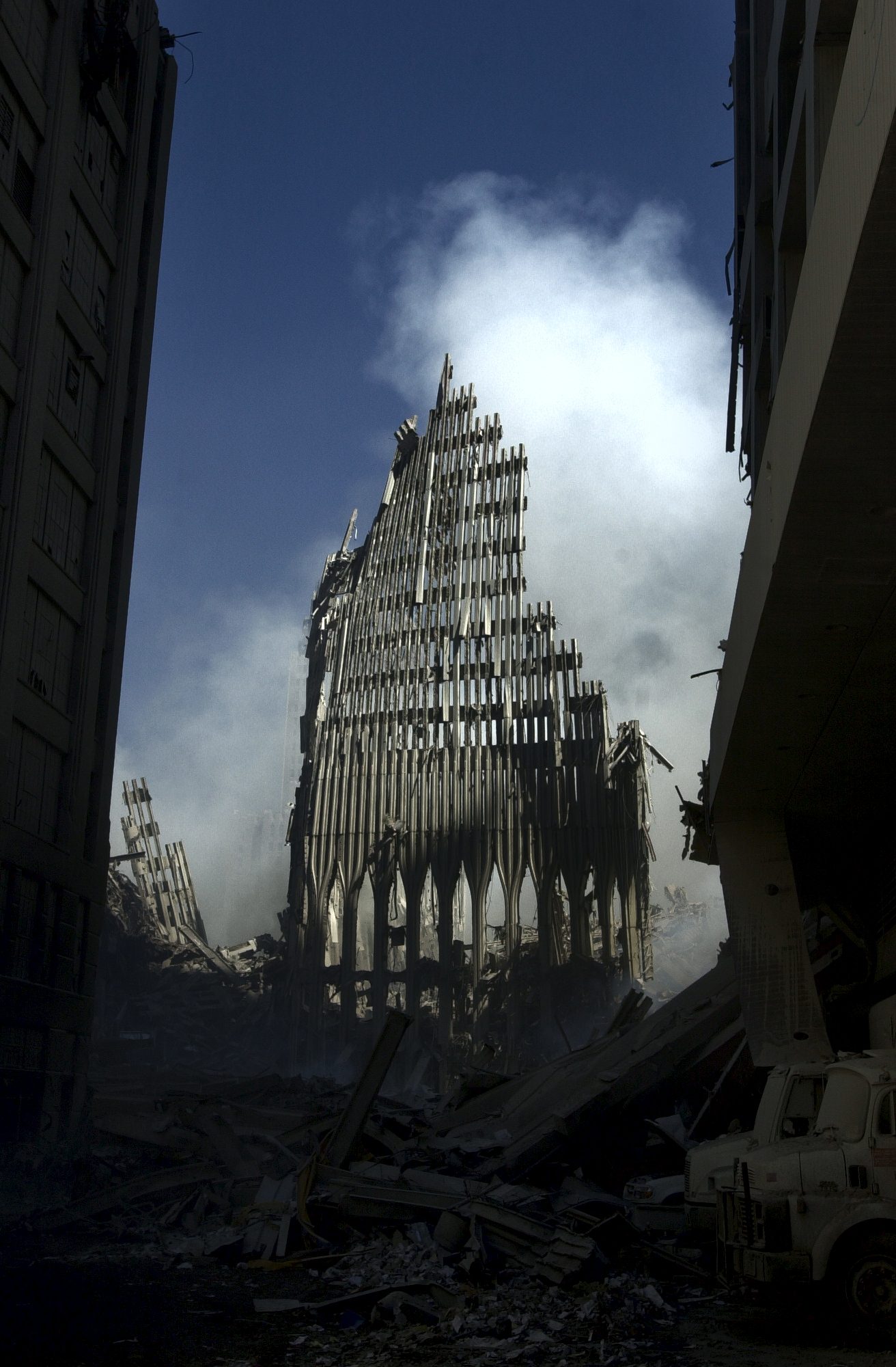 Standing remnant of WTC 2 among the debris, three days after the attacks.